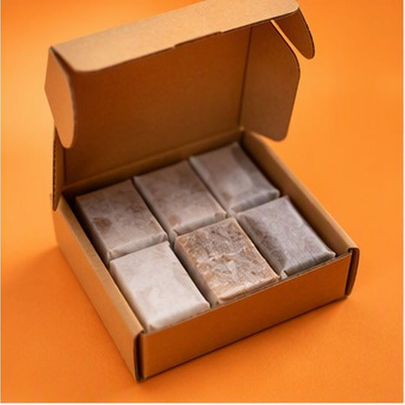 Ember & Iron Starter firelighters in an open cardboard box